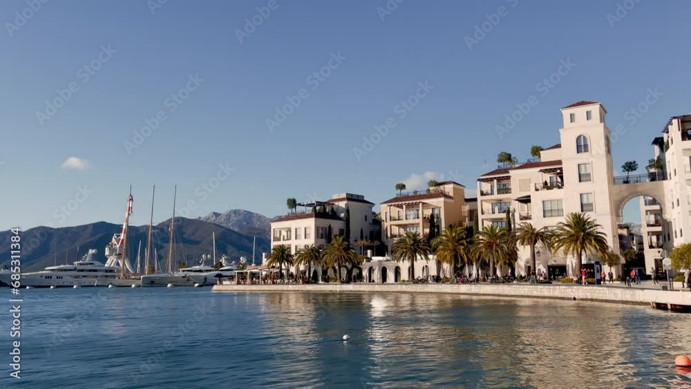 Yachts in Porto Montenegro, with mountains in the background. Shot from the Pine waterfront. Tivat 4k Yachts in Porto Montenegro, with mountains in the background. Shot from the Pine waterfront. Tivat 4k