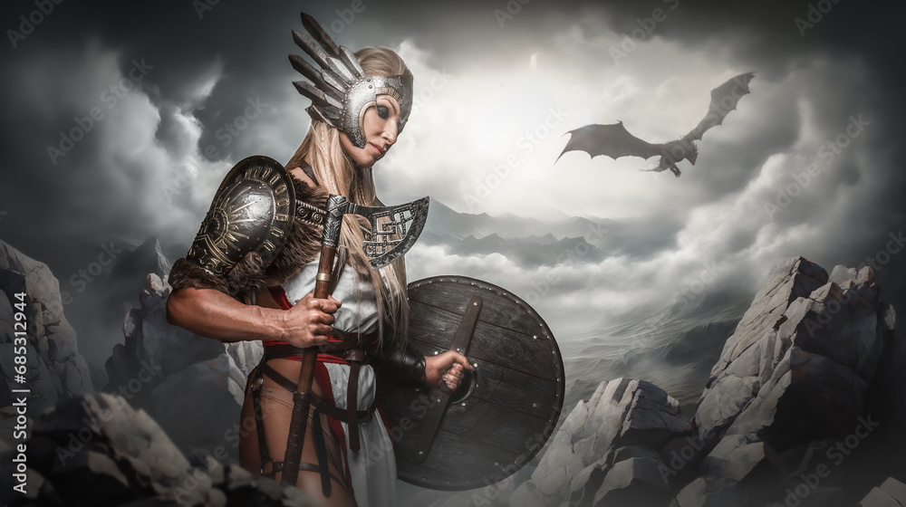 Naklejka premium A valiant Valkyrie with a winged helmet stands in a dramatic mountainous terrain with a dragon flying in the stormy sky