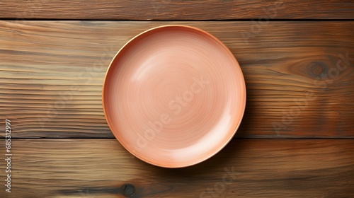 Top View of an empty Plate in blush Colors on a wooden Table. Elegant Template with Copy Space