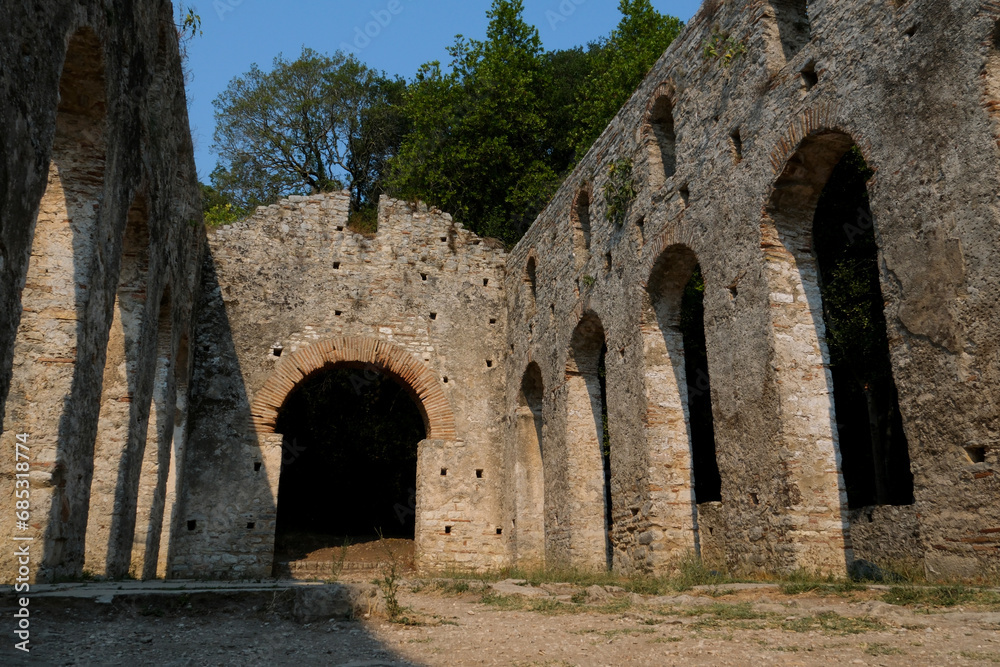Ruins of the Great Basilica in Butrint National Park, Buthrotum, Albania. Triconch Palace at Butrint Life and death of an ancient Roman house Historical medieval Venetian Tower surrounded