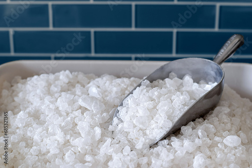 Fotografie Container with water softener salt with a scoop