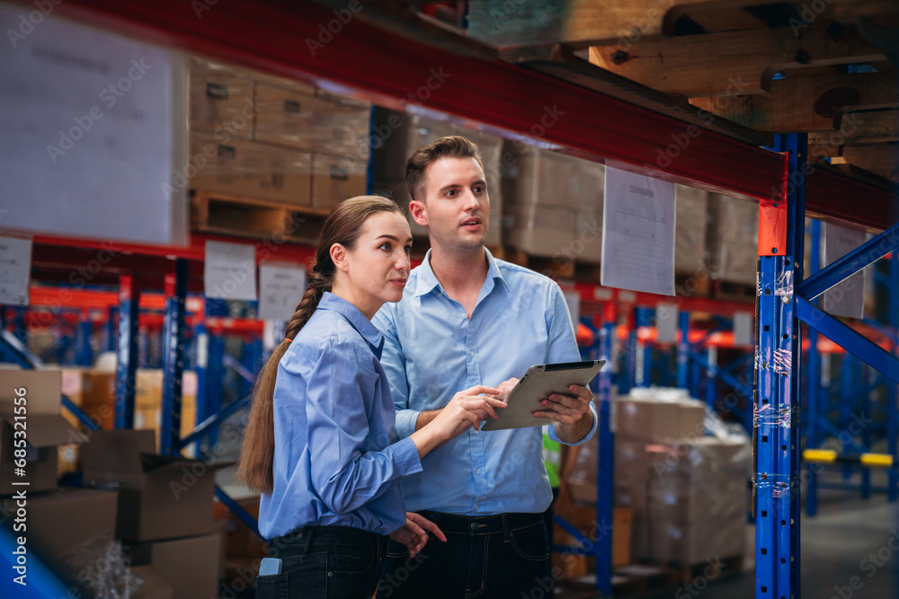 Worker in the warehouse checking the stock is on the shelves at the manufacturing. Engineer is working in the warehouse. Worker in the warehouse checking the stock is on the shelves at the manufacturing. Engineer is working in the warehouse.
