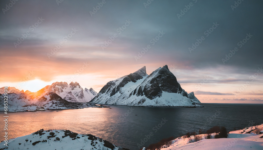 beautiful winter landscapes in lofoten islands northern norway wintry season amazing winter nature scenery fantastic colorful sunset over north fjord above snow covered mountains norway