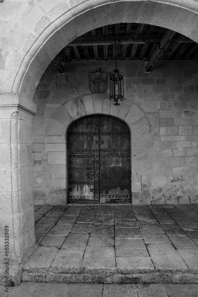 Facade of historic house with beautiful wooden door in Trujillo town Facade of historic house with beautiful wooden door in Trujillo town