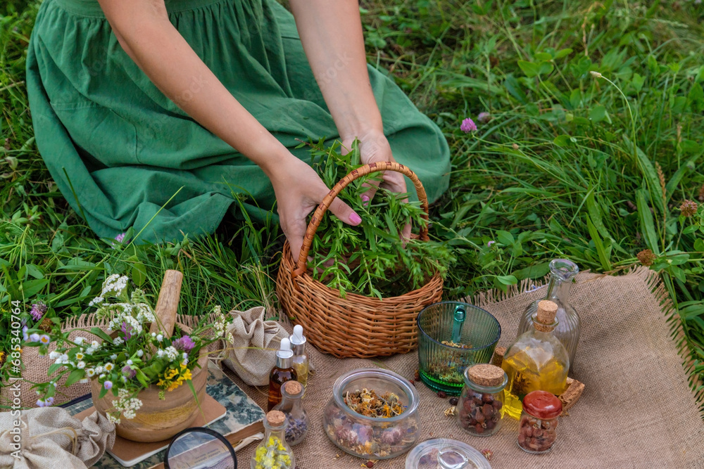 A woman makes herbal tincture. Selective focus. A woman makes herbal tincture. Selective focus.