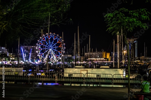 Barcelona, Harbor Lights: Ferris Wheel Illuminations by the Sea