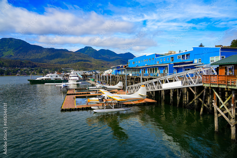 Seaplane moored in the waters of the Gastineau Channel in downtown Juneau - Floating pontoon serving as an airport for Wings Airways, an Alaskan airline offering scenic flights - obrazy, fototapety, plakaty 