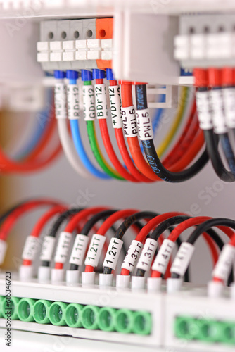 Marking of electrical insulated mounting wires with labels.