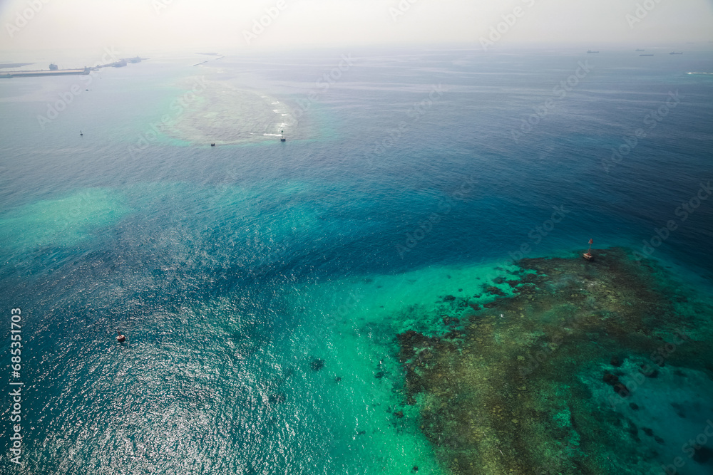 Persian Gulf aerial view, Saudi Arabia. Red beacon tower stands in shallow waters