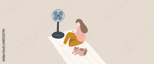 A girl and a cat are sitting in front of the fan in the summer (self-isolation)