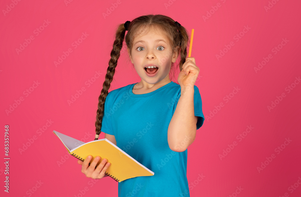 Great Idea. Excited Preteen Girl Holding Notepad And Raising Pencil Up Great Idea. Excited Preteen Girl Holding Notepad And Raising Pencil Up
