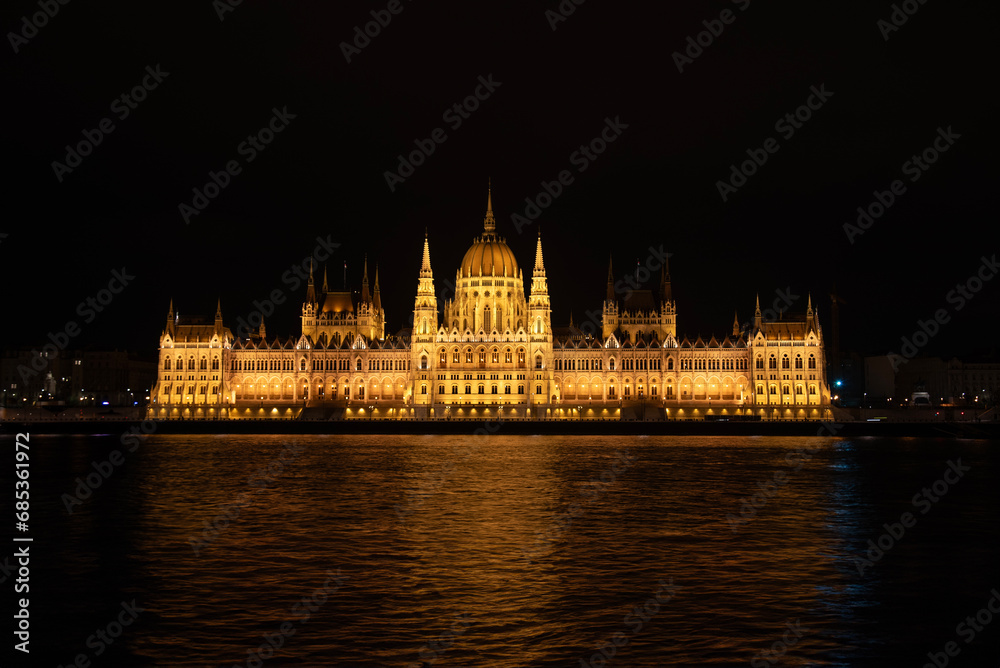 Night shot of the Parliament building in Budapest. Hungary. The building of the Hungarian Parliament is located on the banks of the Danube River, in the center of Budapest.