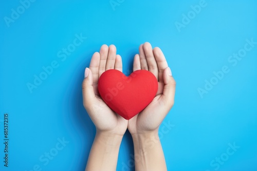 Woman Holding a Red Heart f...