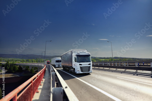 Large Transportation Truck on a highway road through the countryside 