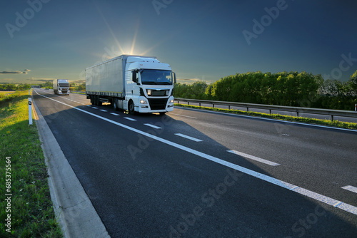 Large Transportation Truck on a highway road through the countryside 