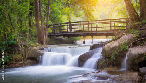high exposure nature landscape, waterfall and bridge in the forest