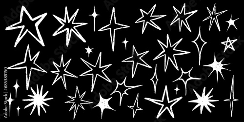 Set of stars. Collection of simple hand drawn stars. Drawn on chalkboard stars. Grunge white stars isolated on black background