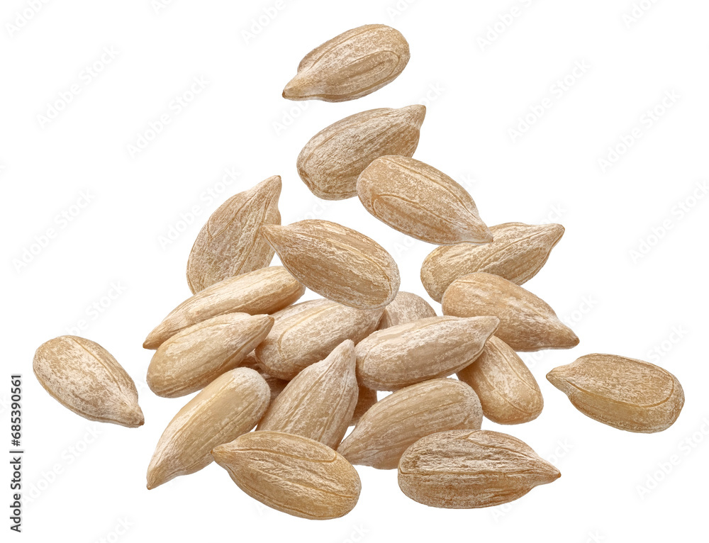 Obraz premium Falling peeled sunflower seeds isolated on white background