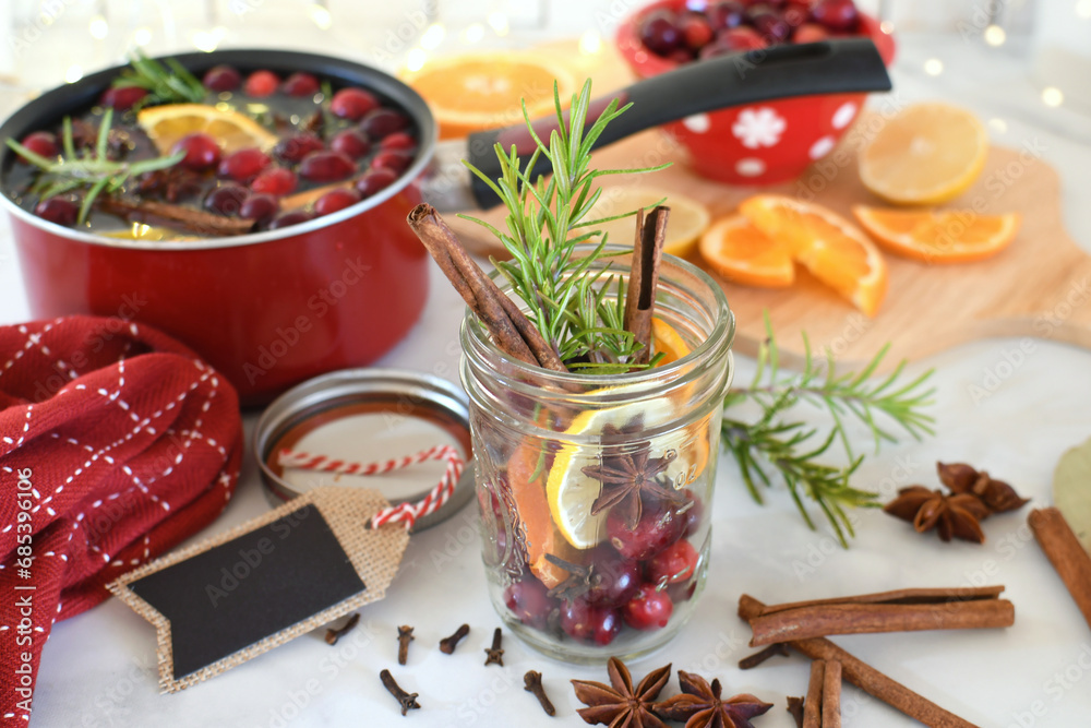 Making Christmas Scent to give as a gift - oranges, lemons, cranberries, cinnamon, star anise, cloves spices Making Christmas Scent to give as a gift - oranges, lemons, cranberries, cinnamon, star anise, cloves spices