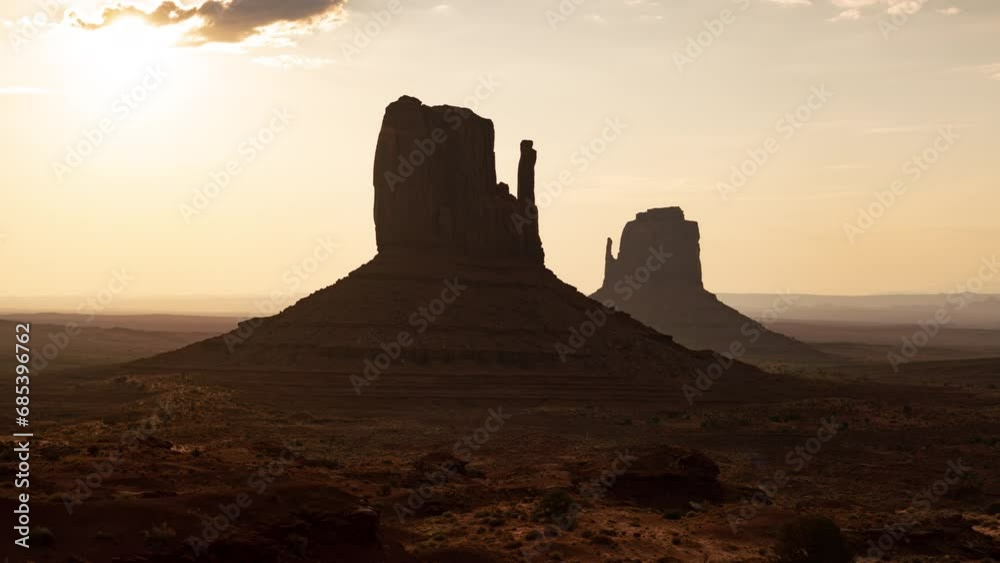 Monument Valley West and East Mitten Butte Sunrise Time Lapse Tilt Up Arizona Southwest USA Monument Valley West and East Mitten Butte Sunrise Time Lapse Tilt Up Arizona Southwest USA