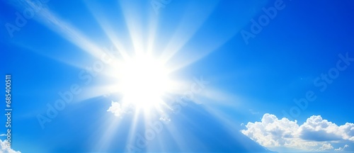 Sun shining brightly with rays of light on blue cloudy sky from Generative AI
