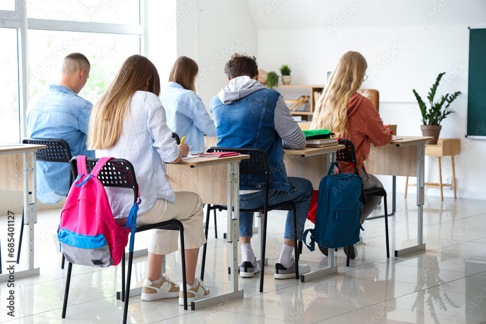 Group of classmates sitting in classroom Group of classmates sitting in classroom