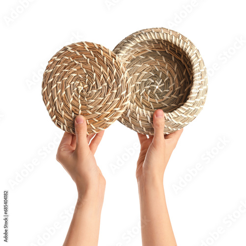 Female hands holding wicker...