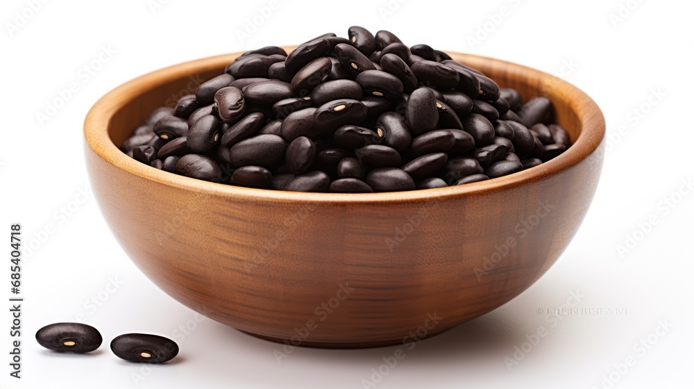 Fototapeta premium organic black beans in a bowl on white background 