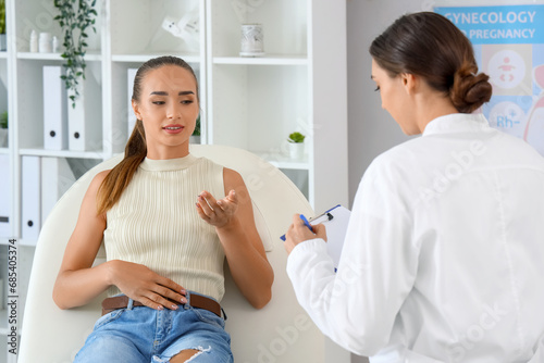 Female gynecologist talking...