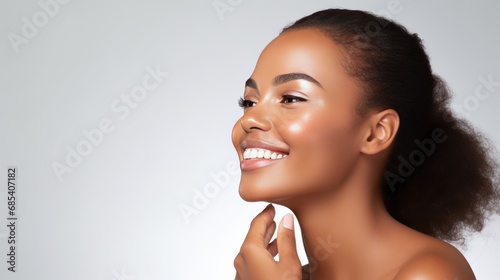 Fashion and women concept,Woman smiling while touching her flawless glowy skin with copy space  photo