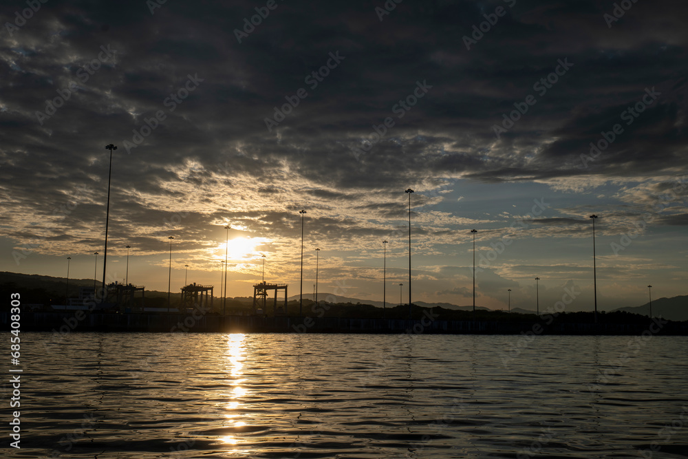 Dramatic Sky with Silhouettes of Poles, Sunset in the Port of La Union in Salvador
