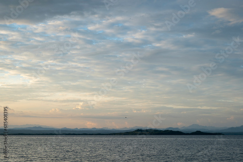 Obraz na płótnie Coastline Seen From Afar with Volcanic Mountain Ranges with Lush Vegetation Forests and Beaches in Front of a Calm Ocean near La Union, El Salvador w salonie