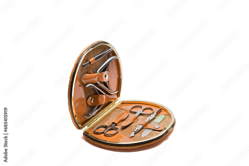 Set of steel manicure instruments and tools in orange leather case isolated on white background Set of steel manicure instruments and tools in orange leather case isolated on white background