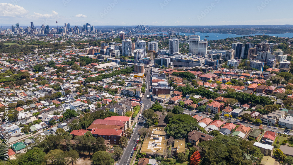 Aerial drone view of Bondi Junction in the Eastern Suburbs of Sydney, NSW Australia with Sydney City in the background on a sunny day