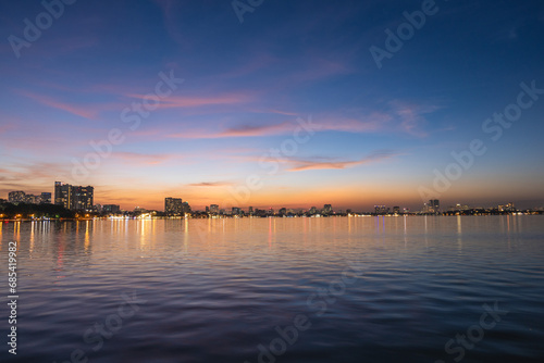 skyline of hanoi city by the west lake in Vietnam at night