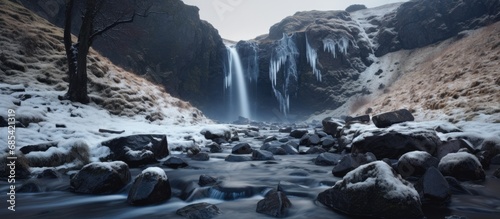 Scotland's Grey Mare's Tail Waterfall and burn in Galloway Forest Park during winter.