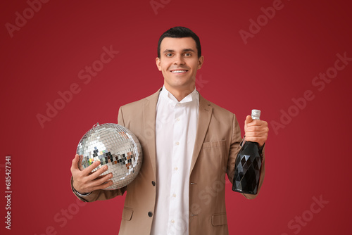 Young man with disco ball a...
