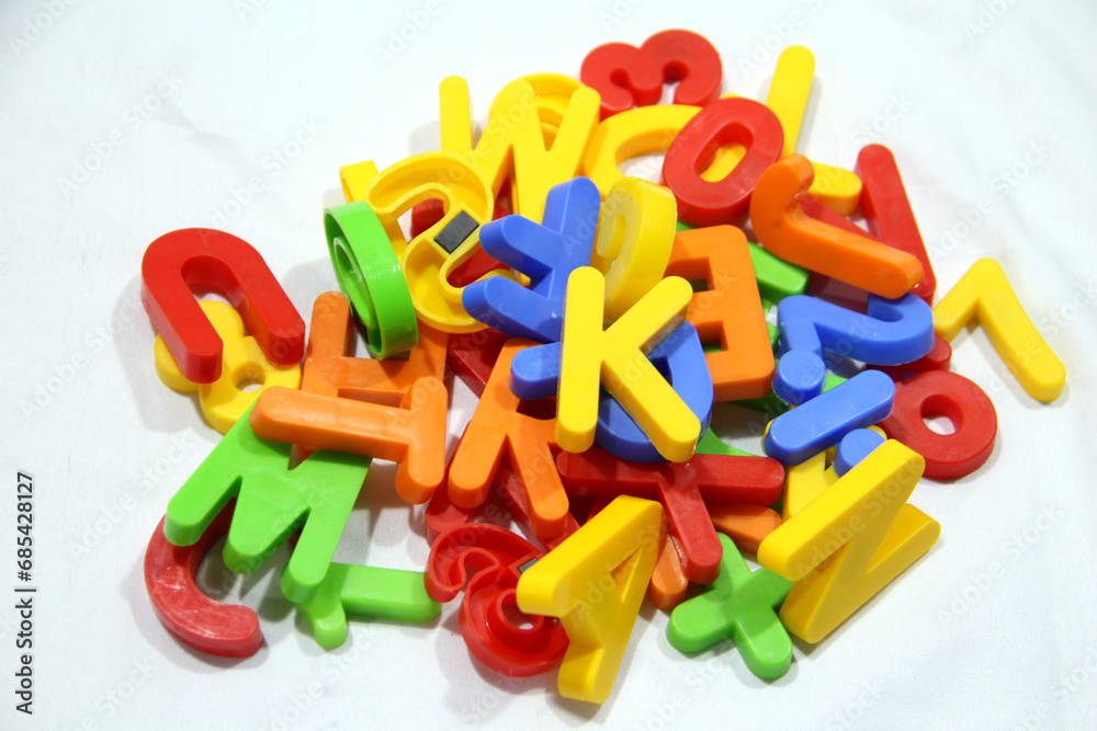 Fototapeta premium Colourful alphabet character written in multicolored plastic for kids. kids learn letters.