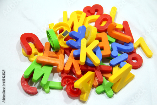 Colourful alphabet character written in multicolored plastic for kids. kids learn letters.