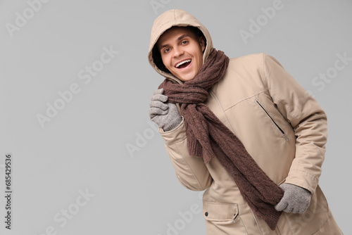 Young man in stylish puffer...