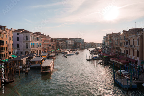 Scenic view of boats cruising along the Grand Canal in Venice, Italy. Serene and picturesque scene with tranquil and beautiful atmosphere. © Aerial Film Studio
