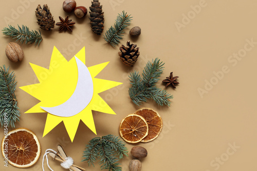Paper sun with fir branches...