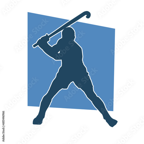 Silhouette of a land hockey player in action pose.