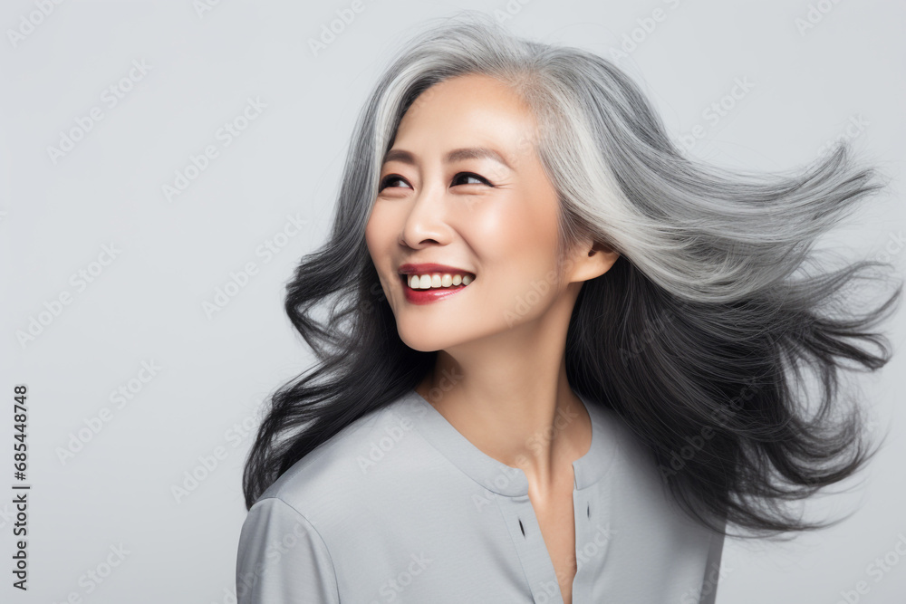 Beautiful grey hair asian woman smiling with smooth face skin. Beautiful grey hair asian woman smiling with smooth face skin.