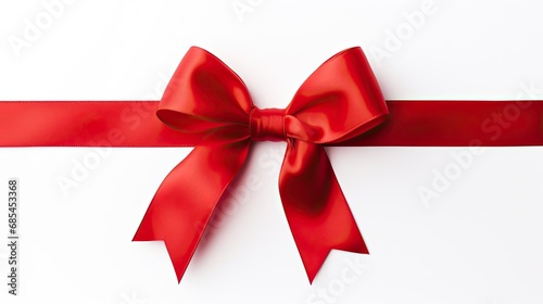Image of red ribbon with bow isolated over white background. Holiday season decoration