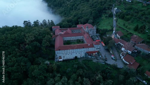 Aerial Footage of Santo Estevo Monastery And Foggy Forest, Luintra, Spain photo