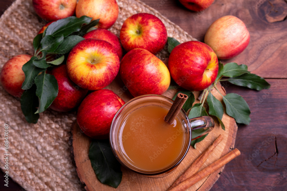 Autumn warm drink. Apple cider in glass cup on wood background with. Top view Autumn warm drink. Apple cider in glass cup on wood background with. Top view