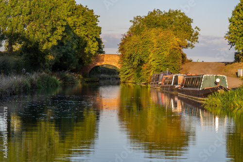 Foto Boats, Bridge and trees reflecting on the canal
