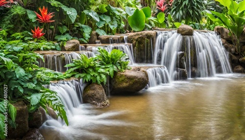 waterfall in tropical garden during spring season. 