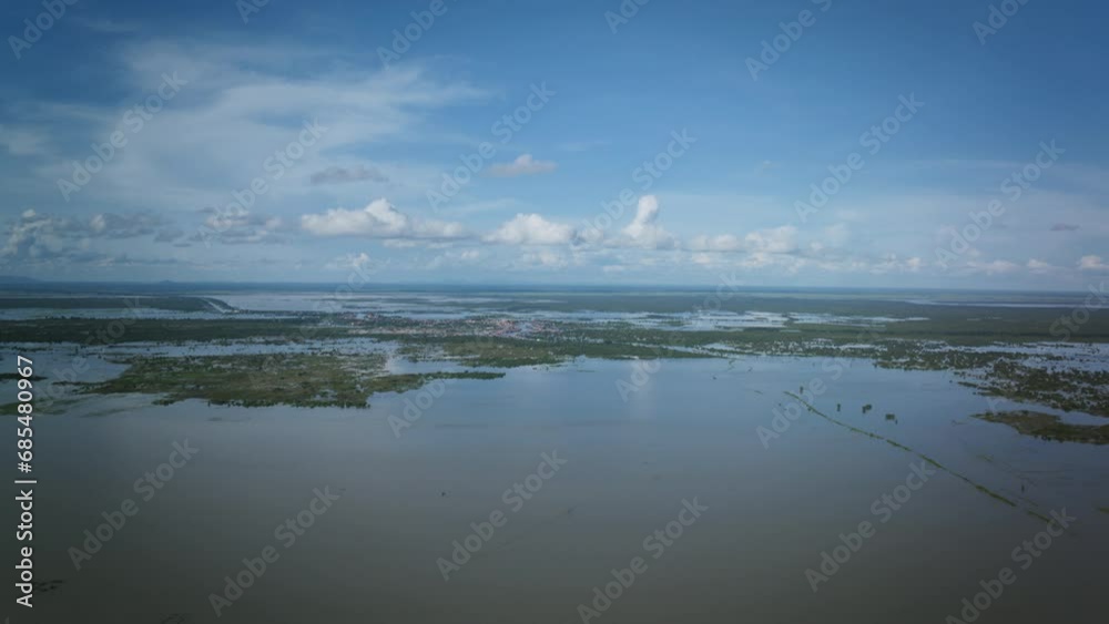 Aerial hyperlapse of the lake of Tonlé Sap in Cambodia that focuses on the floating villages that are on the lake. Aerial hyperlapse of the lake of Tonlé Sap in Cambodia that focuses on the floating villages that are on the lake.